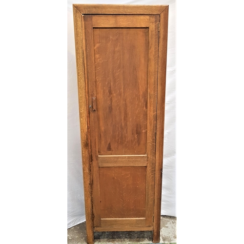 599 - OAK CUPBOARD
with a panelled door opening to reveal a shelved interior, 173cm high