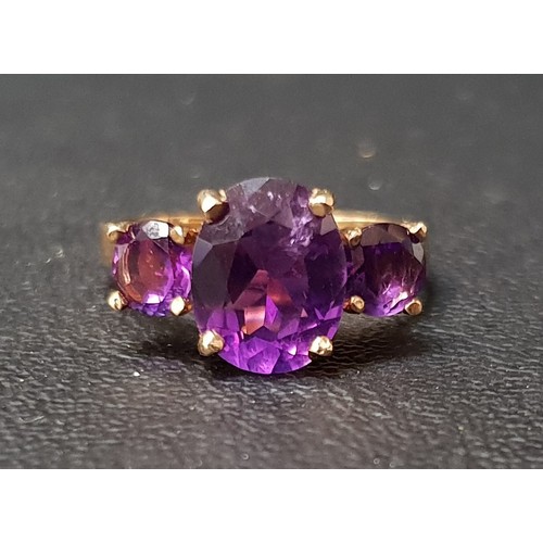 110 - GRADUATED AMETHYST THREE STONE RING
the central oval cut amethyst approximately 2.5cts flanked by ro... 