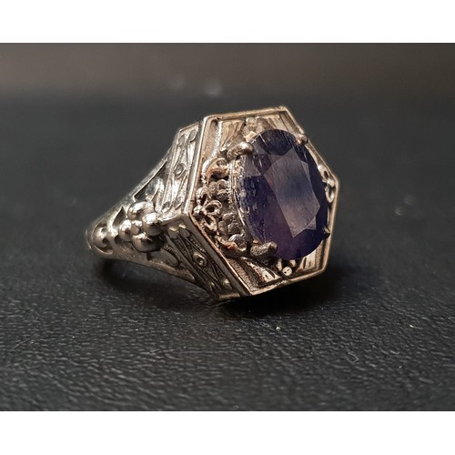 118 - BLUE SAPPHIRE SET DRESS RING
the oval cut sapphire approximately 6cts, with relief moulded hexagonal... 