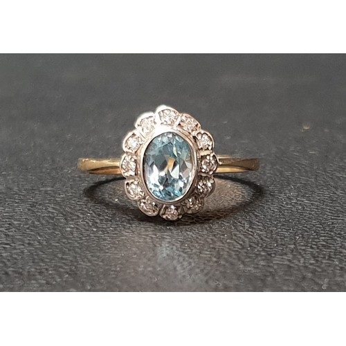 39 - BLUE TOPAZ AND DIAMOND CLUSTER RING
the central oval cut topaz approximately 0.75cts in twelve diamo... 