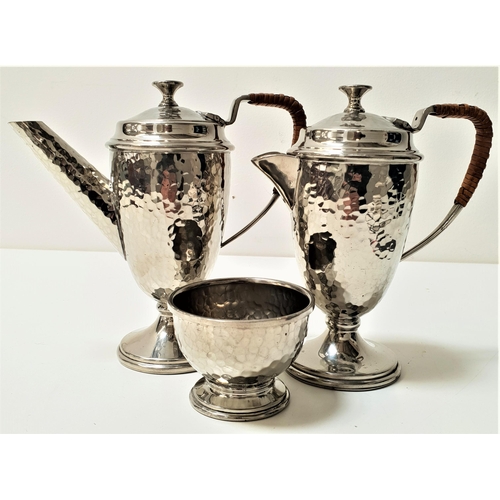 314 - CASTLE PEWTER TEA AND COFFEE SET
comprising a tea pot raised on a circular base with an insulated ha... 