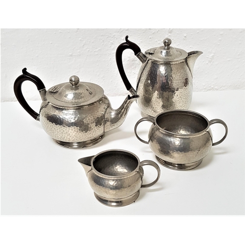 323 - HAMMERED PEWTER TEA SET
comprising a tea pot, hot water jug, twin handled sugar bowl and milk jug (4... 