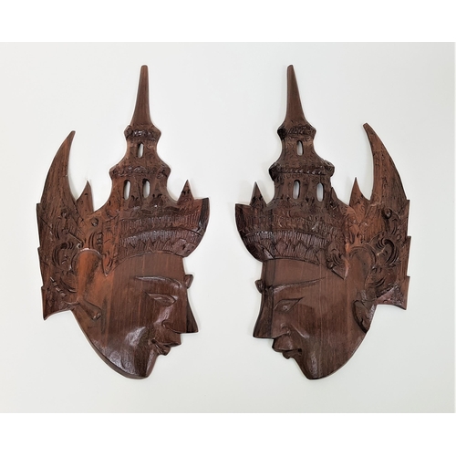 283 - TWO BALINESE CARVED HEADS
in profile and in rosewood, 27cm high (2)