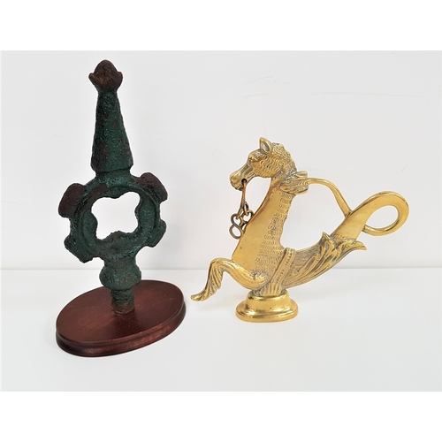 315 - VENETIAN GONDOLA BRASS OAR LOCK
in the form of a sea horse, 19.5cm high; together with a glasgow rai... 