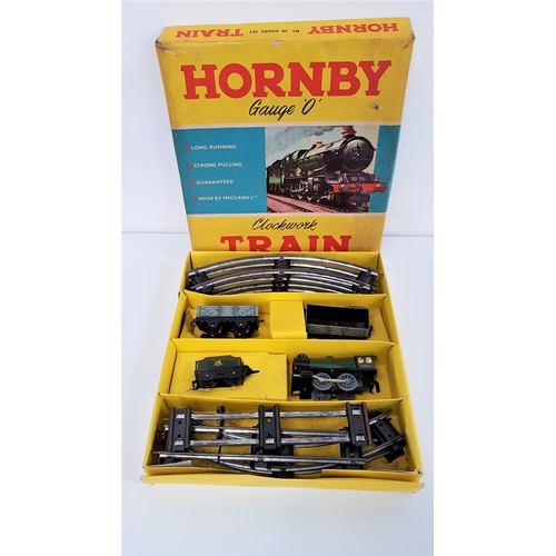 403 - HORNBY O GAUGE CLOCKWORK TRAIN SET
number 20 Goods Set, with tender and two wagons and track, in ori... 