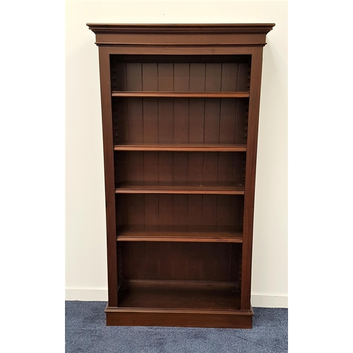 470 - MAHOGANY BOOKCASE
with a moulded top above four adjustable shelves, standing on a plinth base, 183cm... 