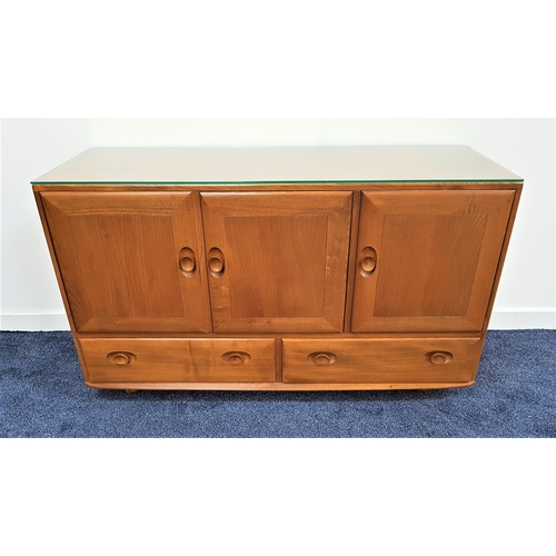 486 - ERCOL LIGHT ELM SIDEBOARD
with three cupboard doors above two drawers, on later casters, 129cm wide