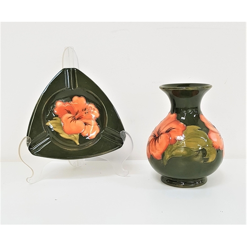 233 - MOORCROFT BALUSTER VASE
decorated in the hibiscus pattern with a green ground, 13cm high, together w... 