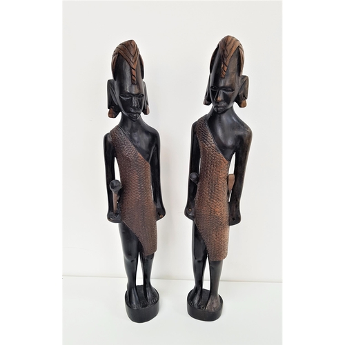 282 - TWO AFRICAN CARVED MAASAI TRIBESMEN
in ebony and carrying weapons, 60cm high (2)