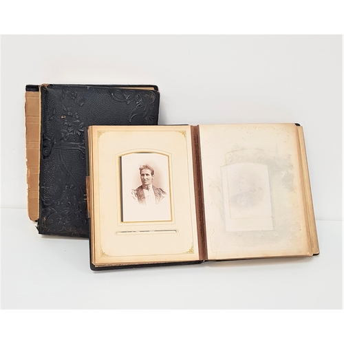 367 - TWO VICTORIAN AND LATER LEATHER BOUND PHOTOGRAPH ALBUMS
with pictures of families, children and pets... 