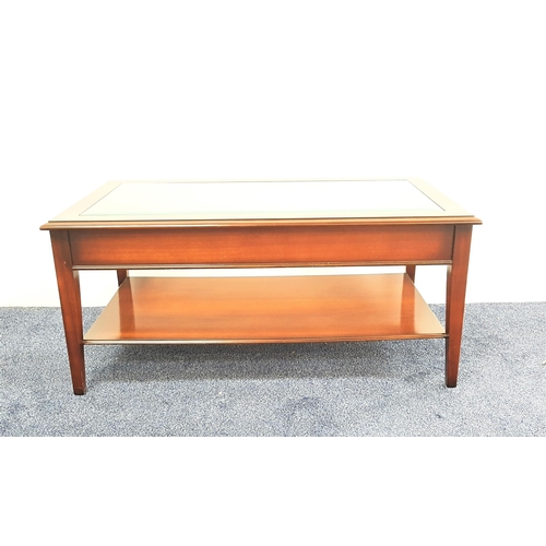 462 - MAHOGANY OCCASIONAL TABLE
with an inset glass top, standing on tapering supports, 102cm wide