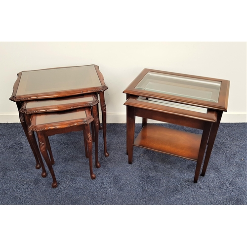 463 - MAHOGANY NEST OF TABLES
with shaped carved tops with inset glass, standing on cabriole supports, 55.... 