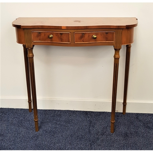 475 - BURR YEW AND CROSSBANDED SIDE TABLE
with a shaped top above two cockbeaded frieze drawers, standing ... 