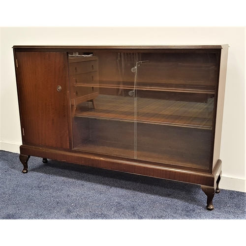 472 - MAHOGANY SIDE CABINET
the moulded top above a cupboard door and two glass sliding doors with two she... 