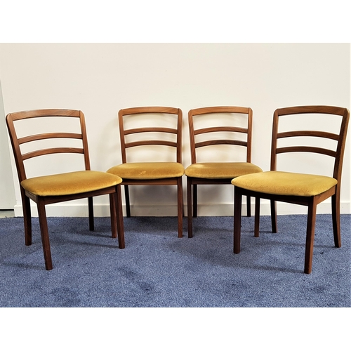 482 - SET OF FOUR G PLAN TEAK DINING CHAIRS
with ladder backs above pale yellow velvet padded seats, stand... 