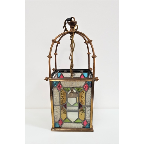 594 - GLASS AND BRASS HALL LANTERN
with a suspension chain and four shaped arms above a four sided shade w... 