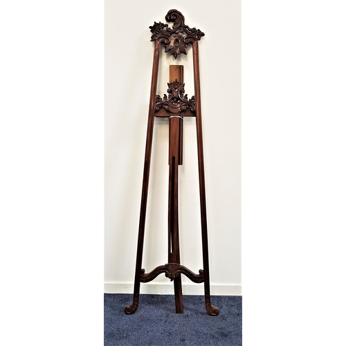 600 - LARGE MAHOGANY EASEL
with pierced and carved decoration, 215cm high