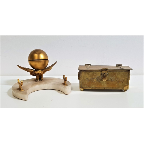 327 - DECORATIVE DESK INKWELL
the glass inkwell within a gilt metal ball raised upon a gilt metal eagle wi... 