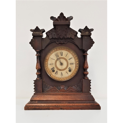 338 - AMERICAN ANSONIA MANTLE CLOCK
in a shaped mahogany case, the circular dial with a brass outer ring w... 