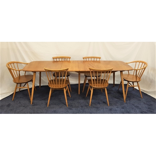 488 - ERCOL LIGHT OAK DINING TABLE AND CHAIRS
the table with a pull apart top and two extra leaves, standi...