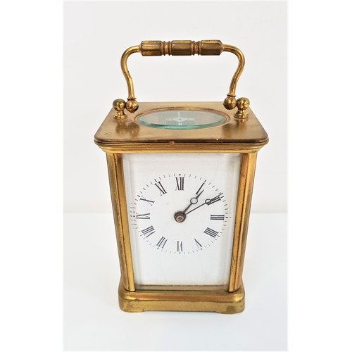 273 - BRASS CARRIAGE CLOCK
with an enamel dial with Roman numerals, bevelled glass panels and a fold over ... 