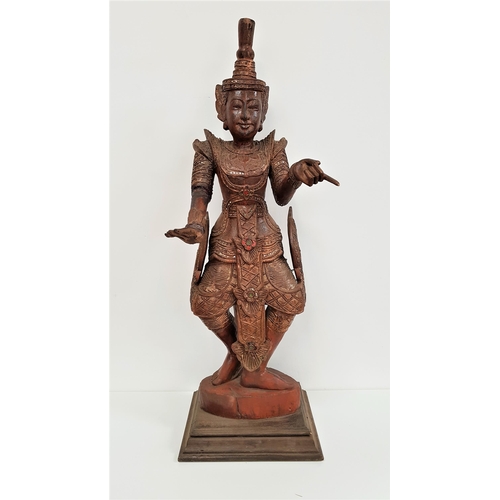 328 - LARGE CARVED WOOD BALINESE DEITY FIGURE
the painted figure with pointing finger to the left hand, th... 