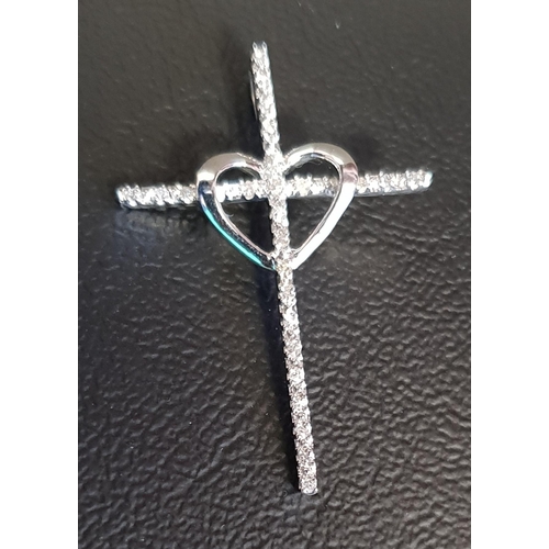 165 - DIAMOND SET CROSS PENDANT
with central heart detail, in unmarked white gold, 3.2cm high