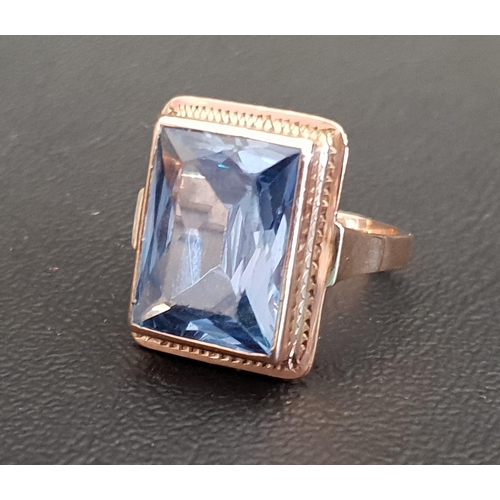 80 - BLUE TOPAZ SINGLE STONE RING 
the rectangular blue topaz measuring approximately 15mm x 11.5mm x 6.1... 