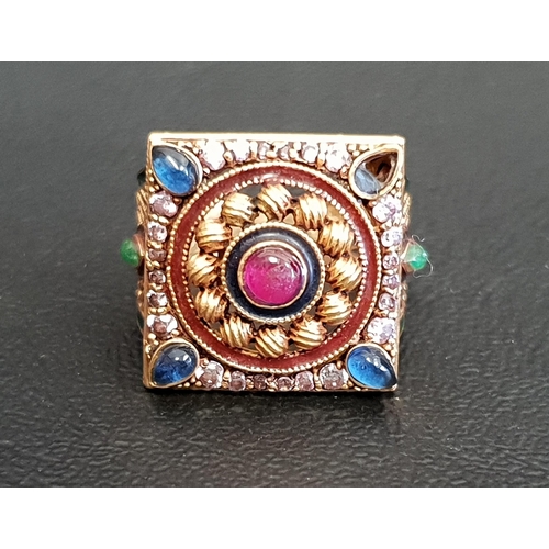 100 - GEM, ENAMEL AND PASTE SET DRESS RING
the central cabochon ruby in paste set decorative surround, wit... 