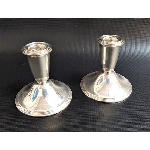 185 - PAIR OF WEIGHTED NEWPORT STERLING SILVER DWARF CANDLESTICKS
marked to bases 'Ce'ent filled reinforce... 