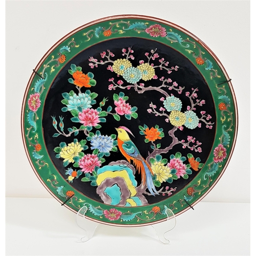 261 - JAPANESE FAMILLE NOIR CHARGER
with a green floral border and centred with a pheasant, with character... 