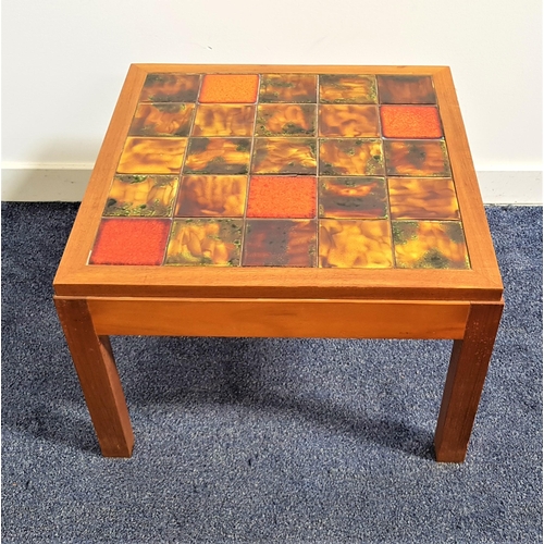 604 - JOHN LEWIS TEAK OCCASIONAL TABLE
with a tiled top, standing on plain supports, 40cm high