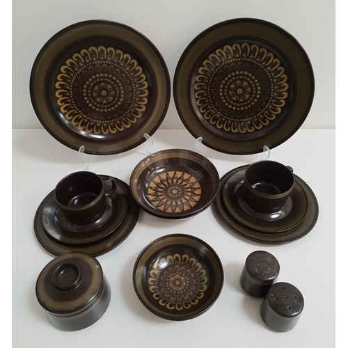 264 - MIKASA POTTERY DINNER SERVICE
with a green and brown decorative ground, comprising six dinner plates... 