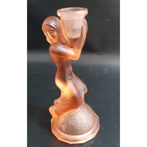 267 - LALIQUE STYLE CANDLESTICK
in orange glass depicting a woman kneeling on a dome clasping the holder, ... 