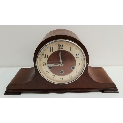 340 - WALNUT CASED MANTLE CLOCK
the circular silvered dial with Arabic numerals and an eight day Westminst... 