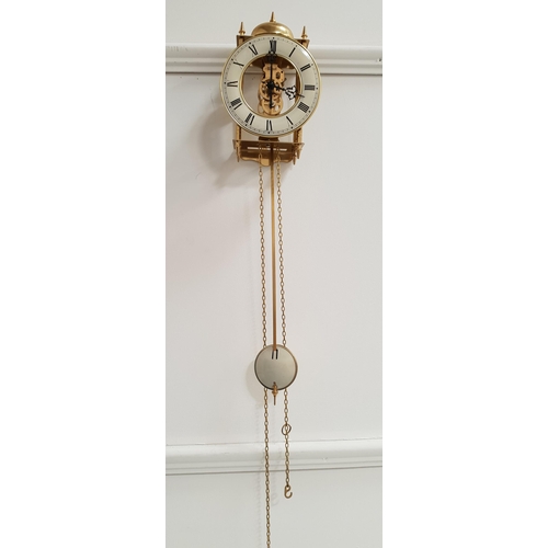 344 - GERMAN HERMLE BRASS LANTERN STYLE CLOCK
with a circular bell above a cream coloured chapter ring wit... 