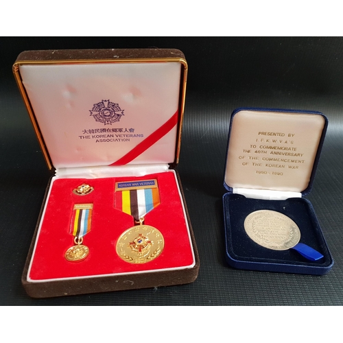 416 - THE KOREAN VETERANS ASSOCIATION MEDAL GROUP
comprising a medal and ribbon, minature medal and ribbon... 