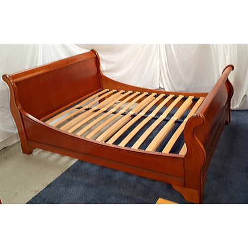 460 - COUTURE CHERRY SLEIGH DOUBLE BED
with a shaped head and foot board, and a slatted base