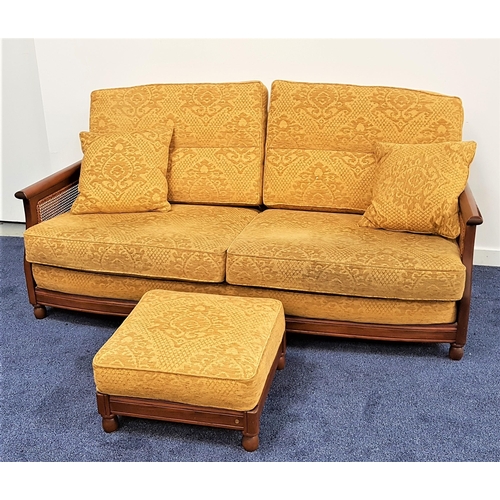 545 - ERCOL BERGER SOFA
in elm with caned side panels, back, seat and scatter cushions in yellow damask, 1... 