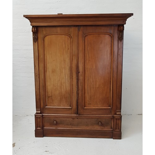 527 - VICTORIAN MAHOGANY WARDROBE
with a moulded cornice above a pair of arched panelled doors flanked by ... 