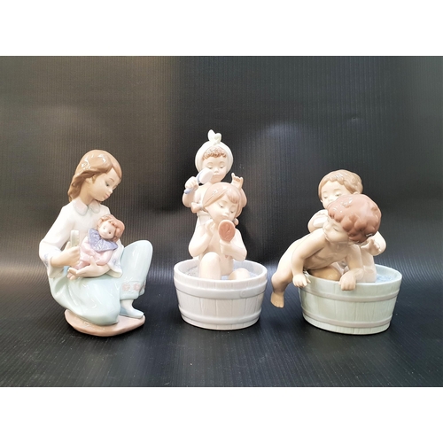 246 - THREE LLADRO FIGURINES
comprising Bathing Beauties - number 6457; Bath Time - number 6411; and Thoug... 