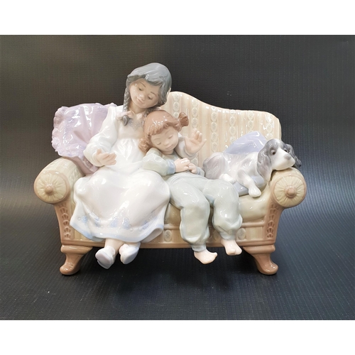 250 - LLADRO BIG SISTER FIGURE GROUP
number 5735, depicting children and a dog seated on a sofa, 21cm wide... 