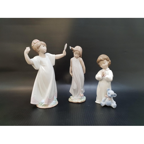 253 - THREE LLADRO FIGURINES
comprising Friend of the Butterflies - number 6963; Nightime Blessings - numb... 