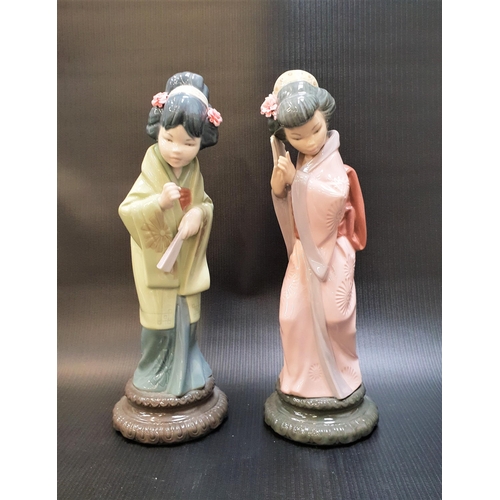 255 - TWO LLADRO GEISHA FIGURINES
comprising Oriental Spring - number 4988 (lacking parasol); and a geisha... 