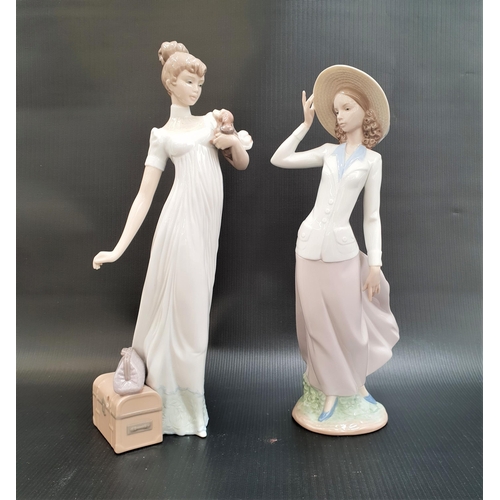 259 - TWO LLADRO FIGURINES
comprising Breezy afternoon - number 5682, 31cm high; and Travelling Companions... 