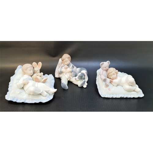 261 - THREE LLADRO FIGURINES
comprising Taking a Snooze - number 6791, approximately 15cm wide; Counting S... 