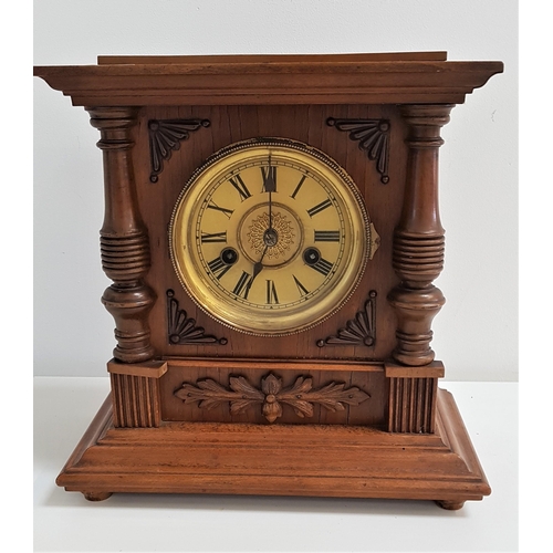 312 - GERMAN WALNUT MANTLE CLOCK
the circular dial with Roman numerals, the rear door with a paper label, ... 