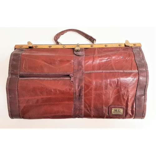 417 - MARC CHANTAL LEATHER GLADSTONE TYPE BAG
with a carry handle and brass fitting and locks, a leather s... 