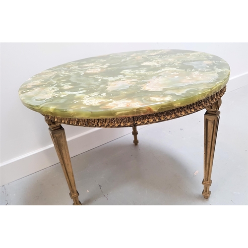 528 - POLISHED GREEN ONYX TOP OCCASIONAL TABLE
with a circular top on a gilt brass base with tapering supp... 