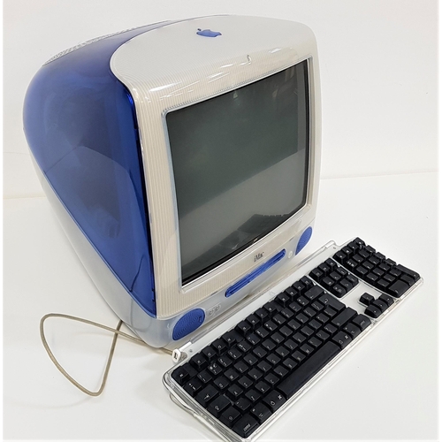 328 - VINTAGE APPLE I MAC COMPUTER
model M5521, EMC 1857, with a blue cased body, keyboard, mouse, softwar... 